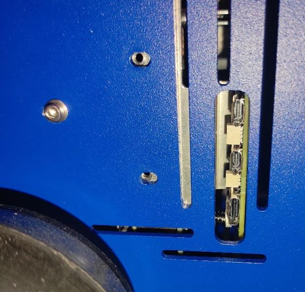 Screwing the RPI+HEATSINK on the chasis outside view.