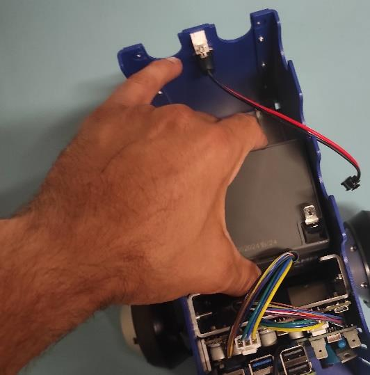 Adding first battery to the robot upper pic 2.