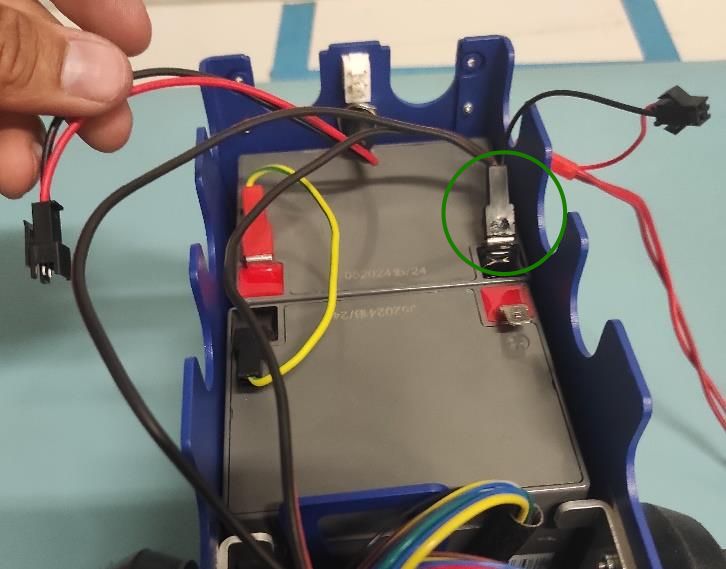 Connecting the wires to the batteries.