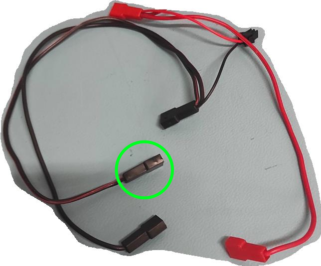 Wire black connector with green circle.