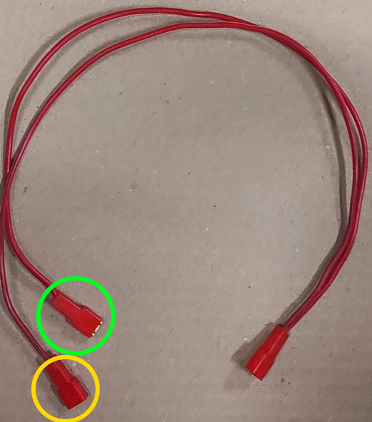 Second wire harness with green and yellow circle.